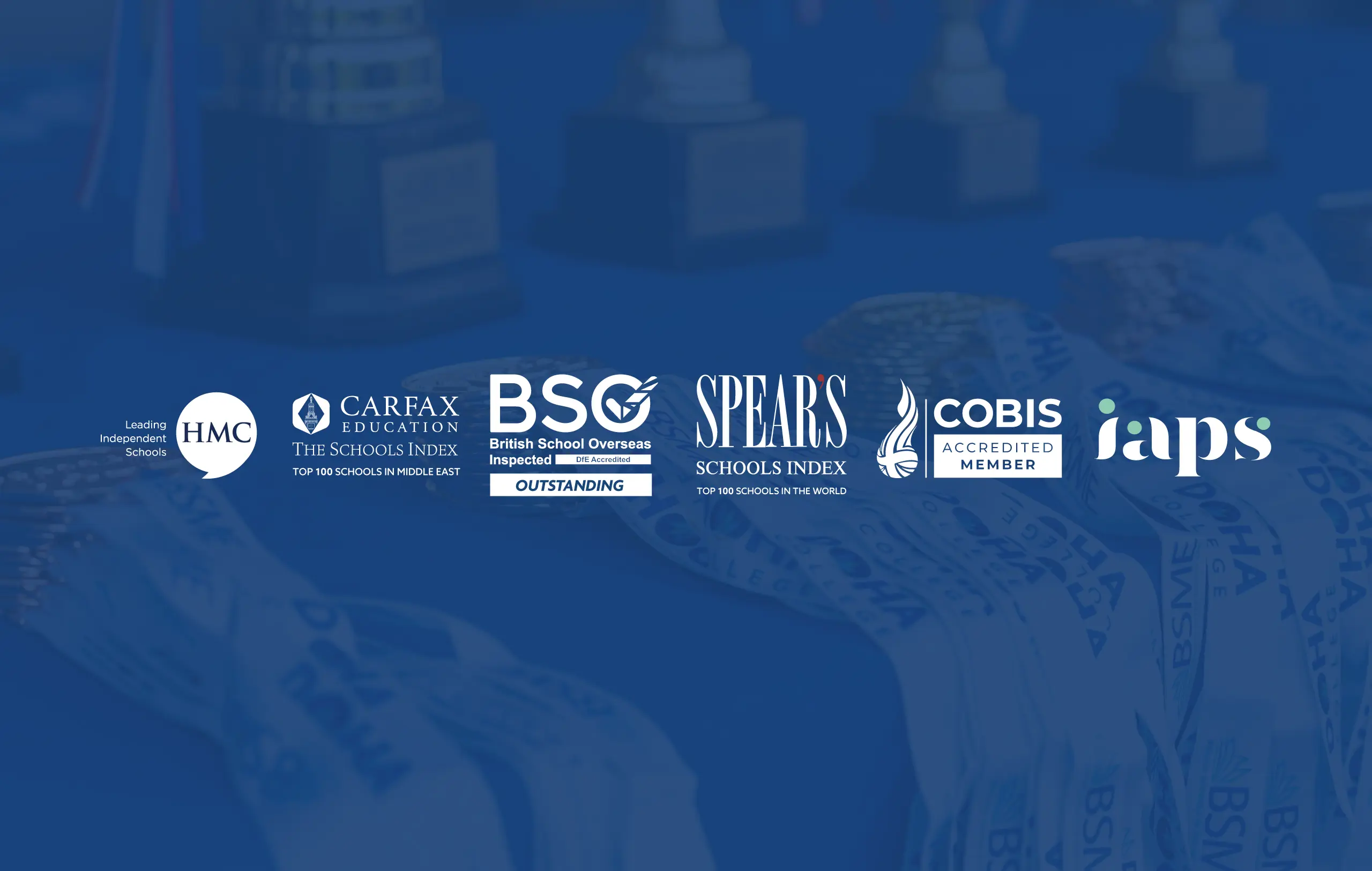 Doha College accreditation with medals and trophies