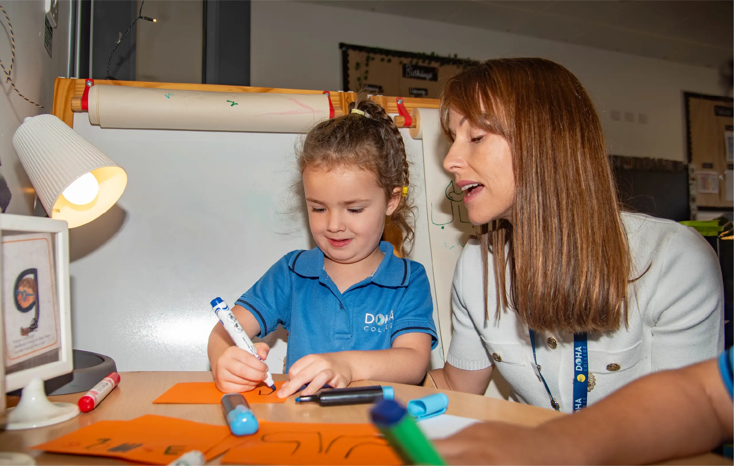 Teacher Instructing Student on Writing