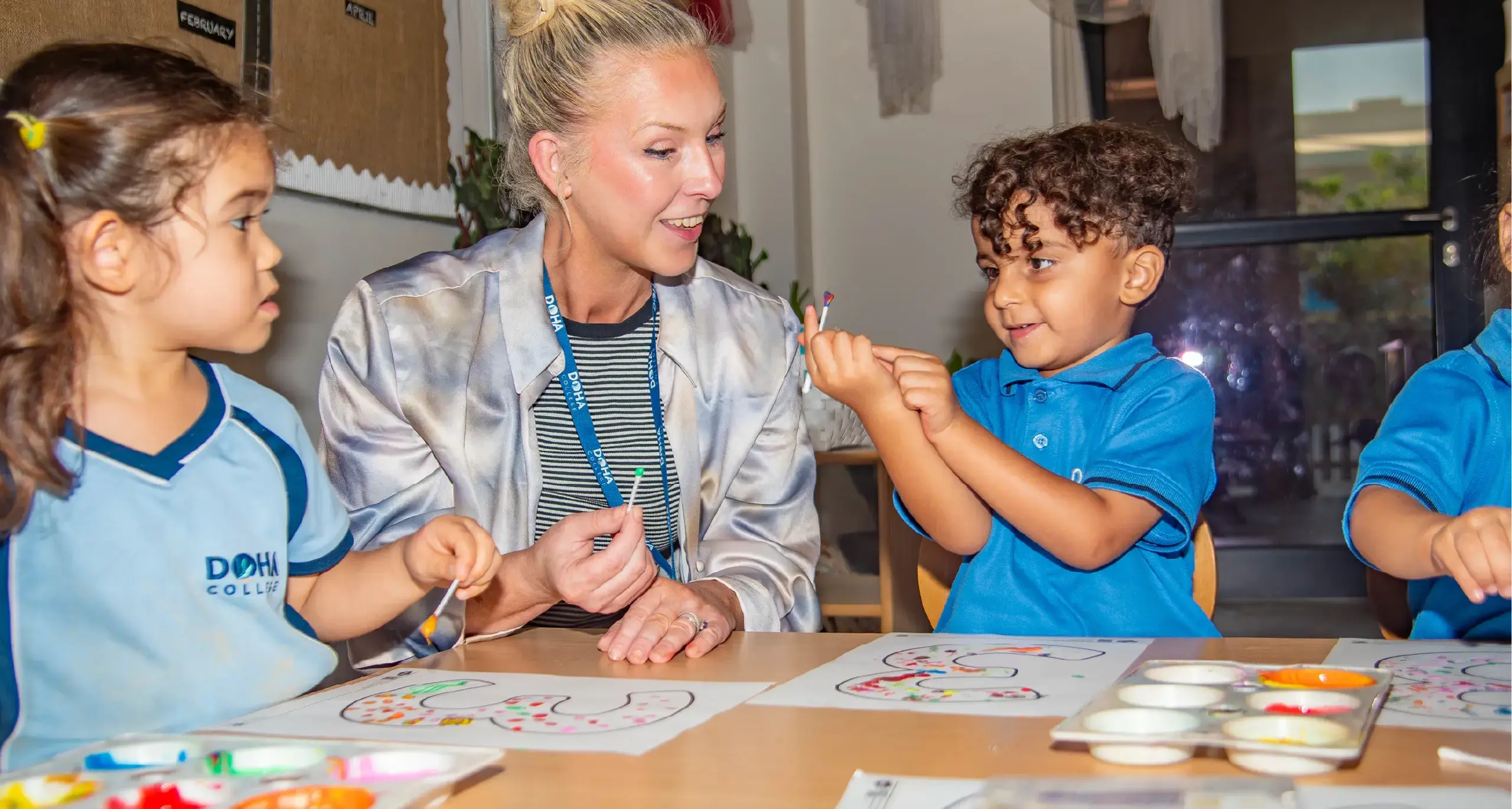 Teacher Doing Art Project with Students