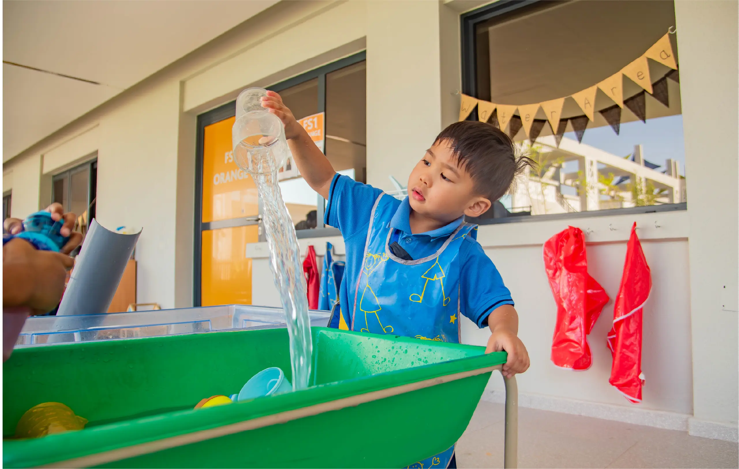 Student Doing Water Activity in Class