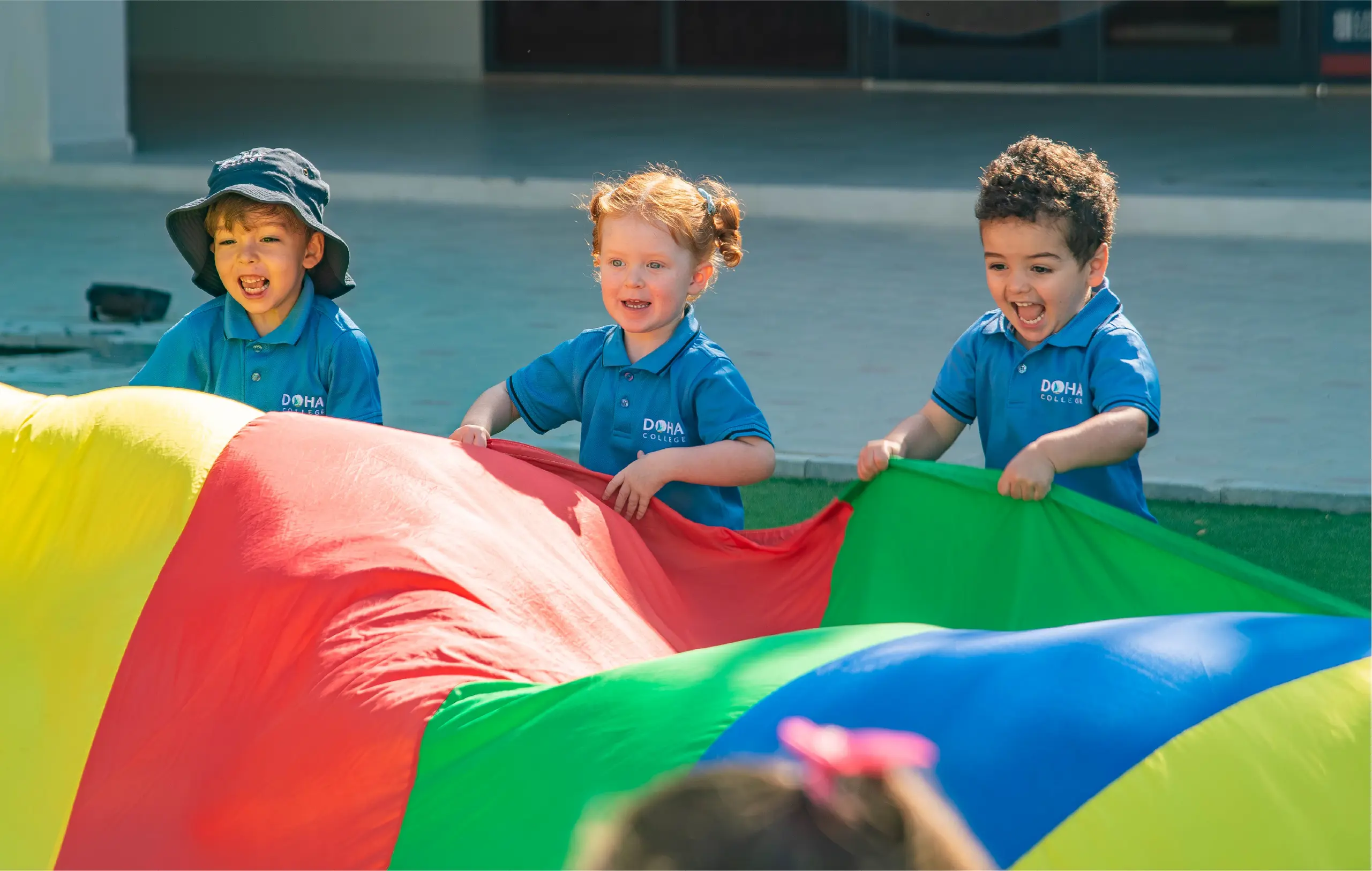 EYFS Students Playing Parachute