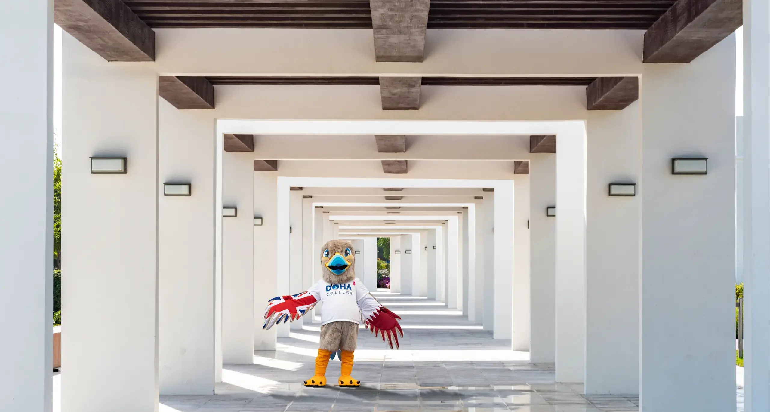 Felix The Doha School Mascot Posing on Campus