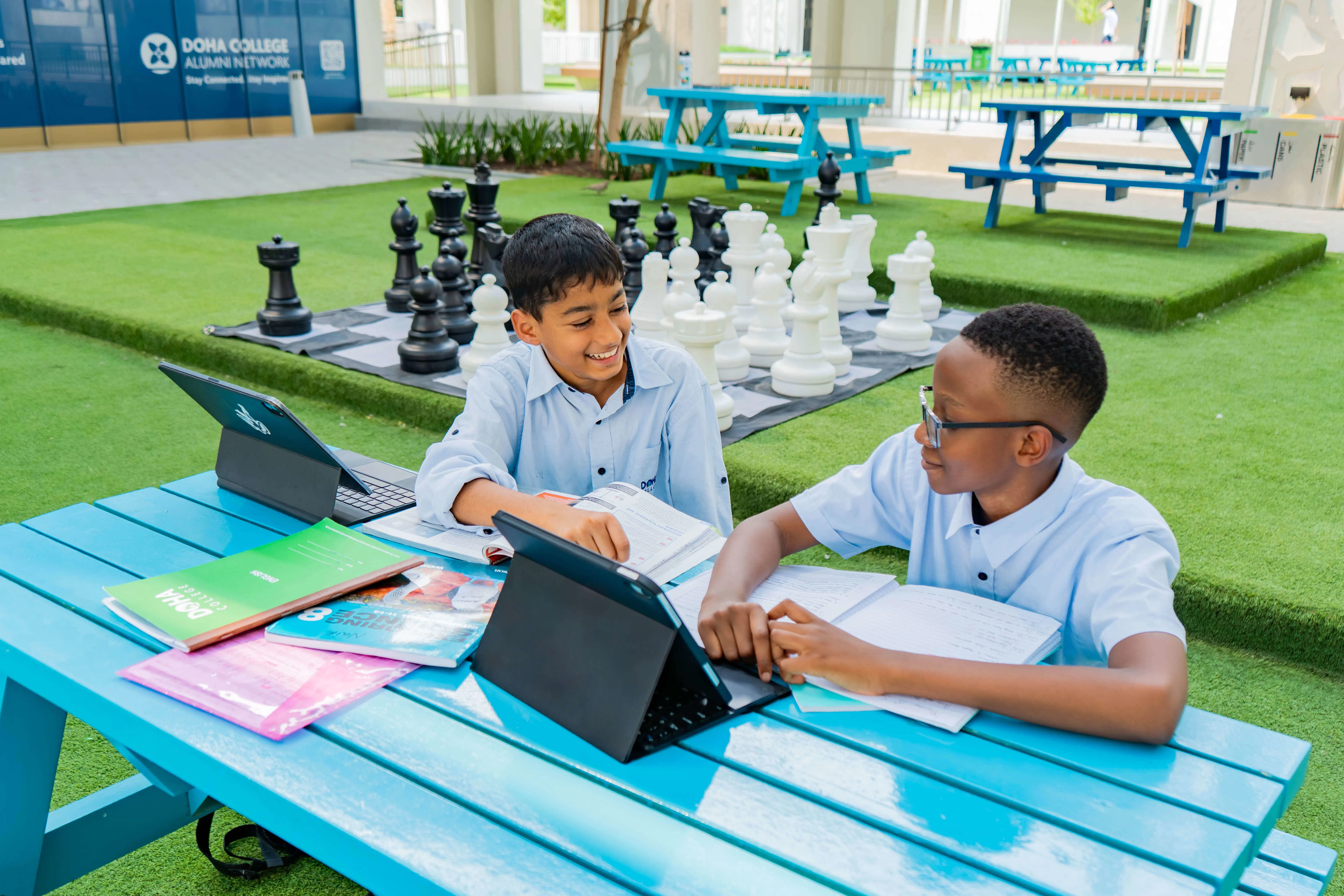 Students Doing School Work in Outdoor Courtyard