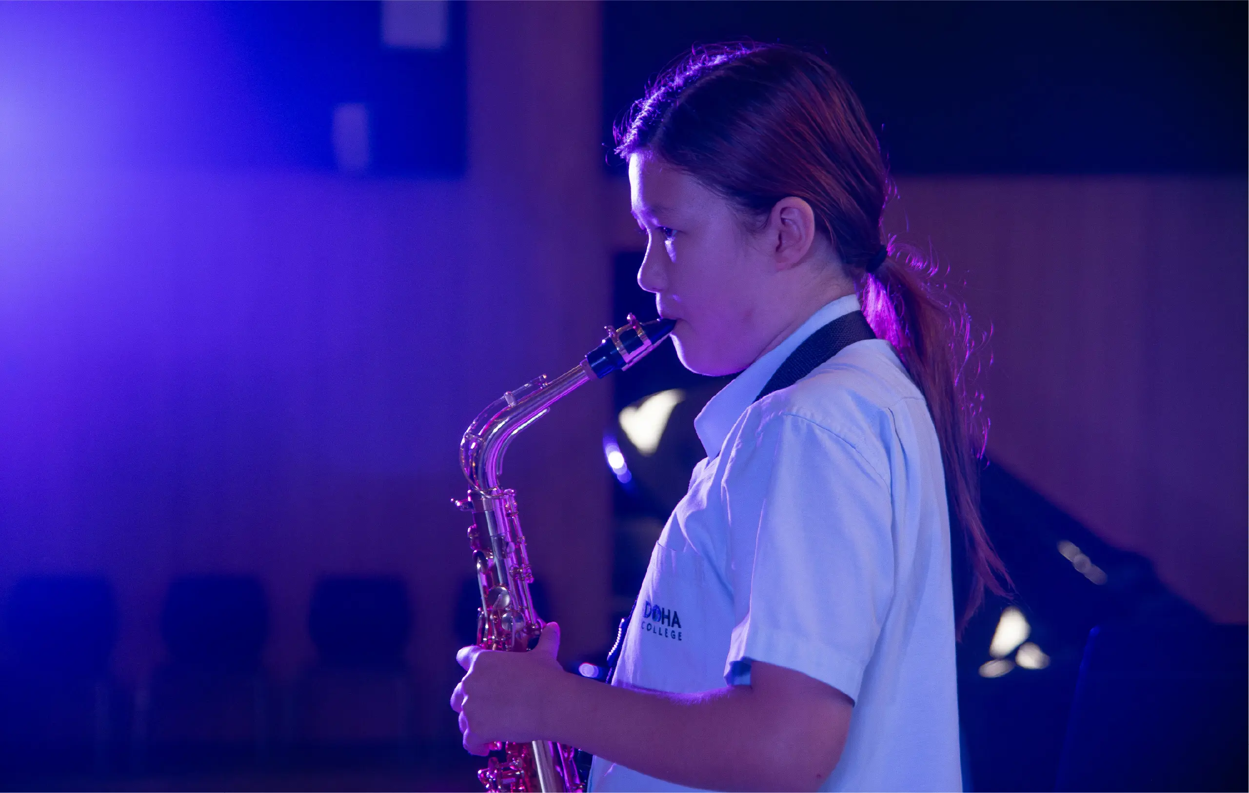 Student Playing Saxophone During Performance