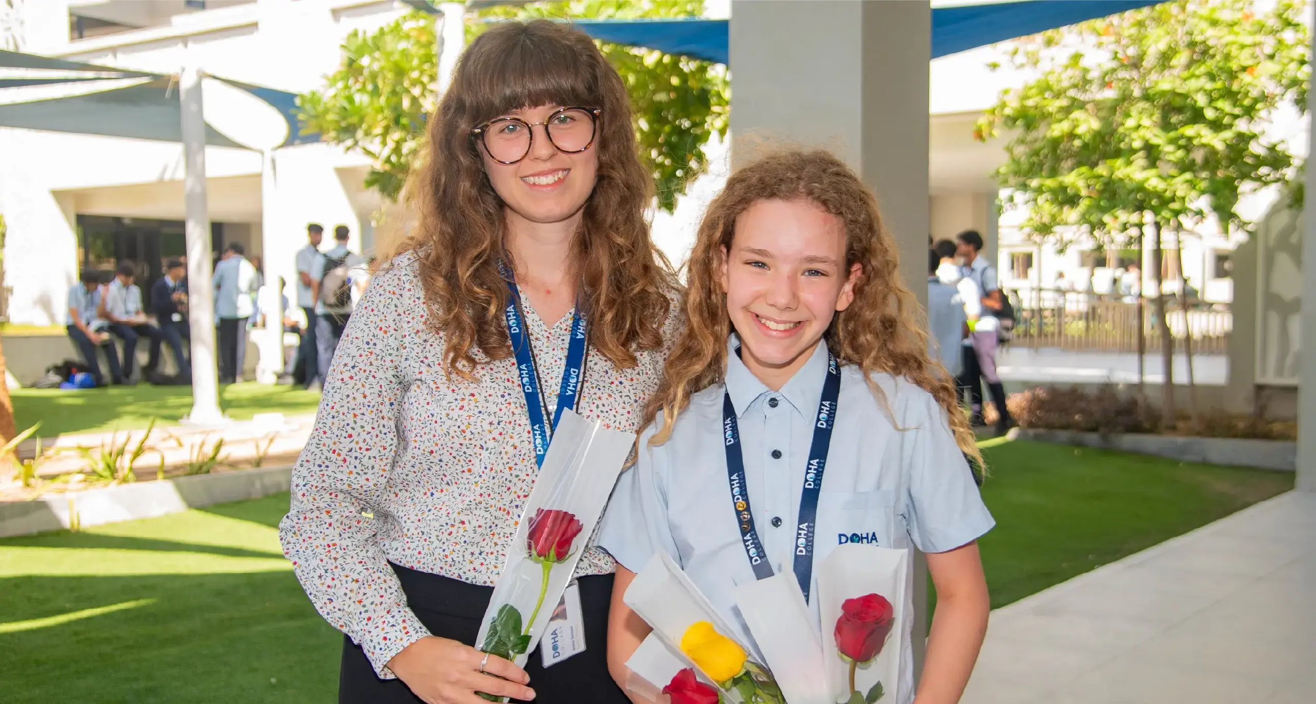 Secondary School STudent Posing with Teacher for Award Ceremony