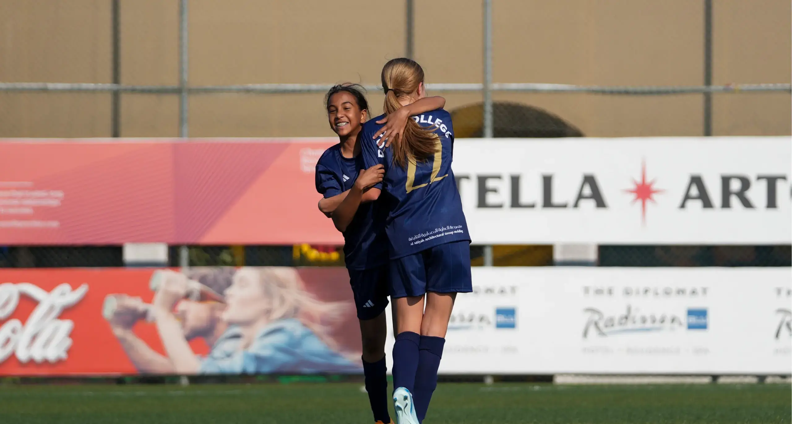 Female Students Playing Football and Celebrating Win